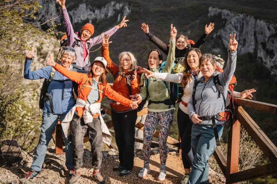 Girls waving in Istria with climbing guide