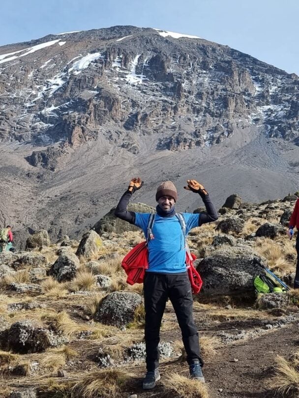 above clouds kilimanjaro trekker
