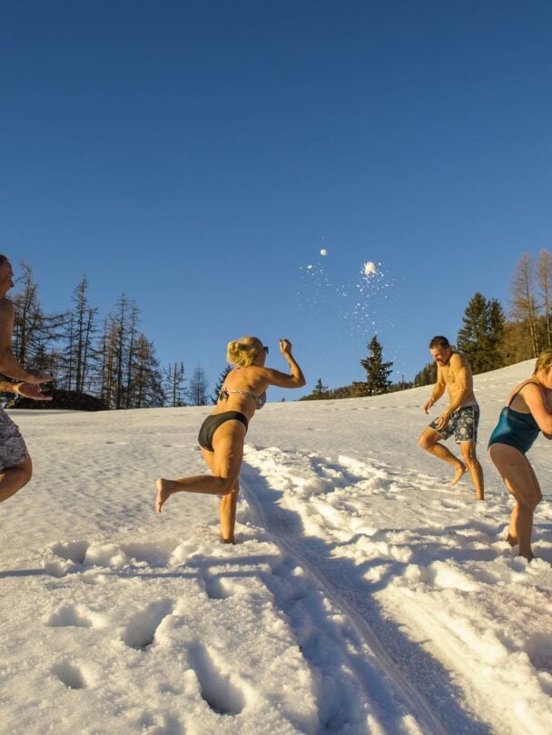 Skiers posing in the Dolomites