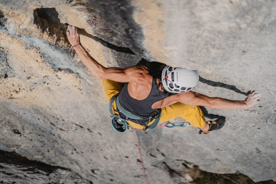 Strong woman climbing in Istria