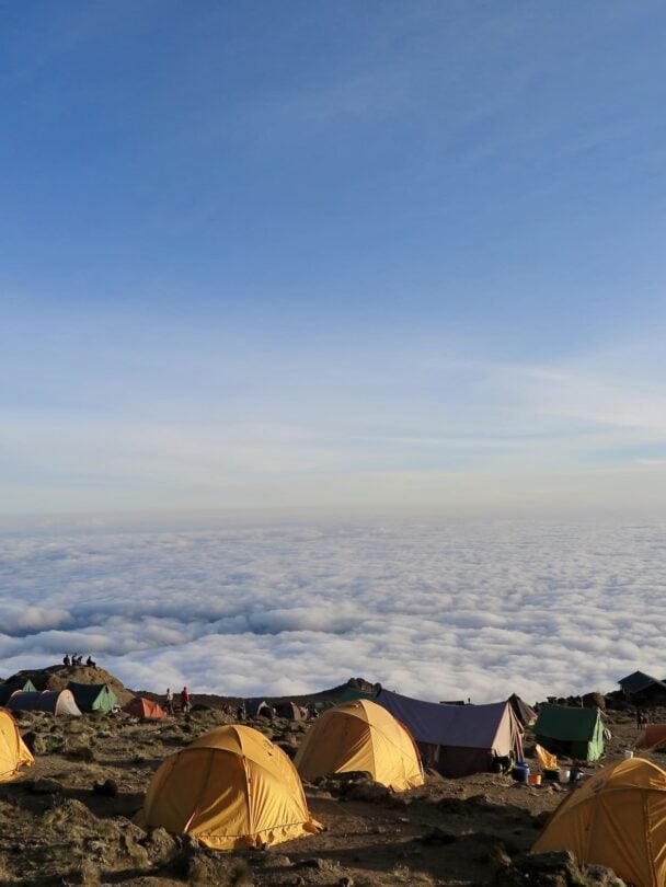 above clouds kilimanjaro trekker