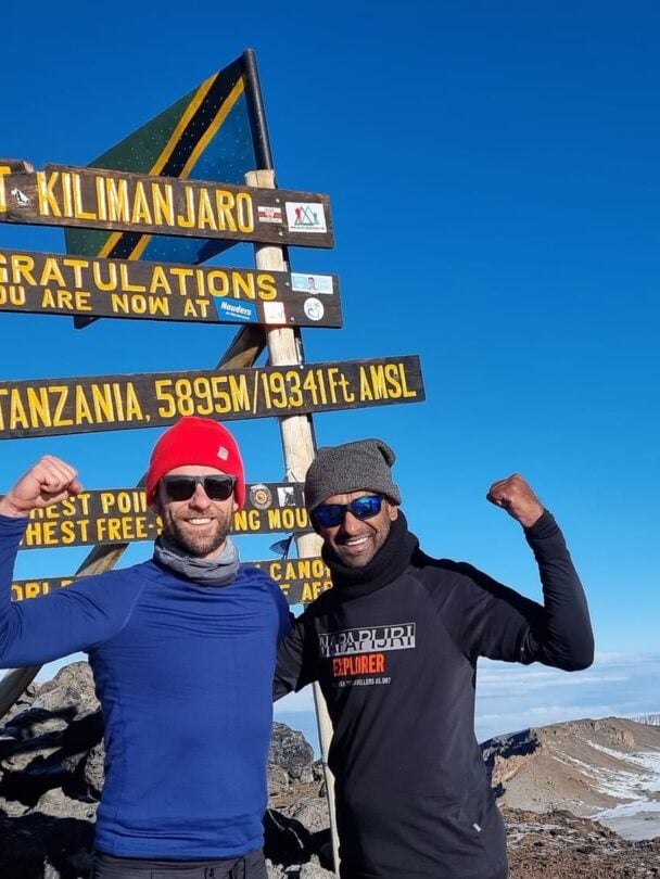 above clouds kilimanjaro trekker