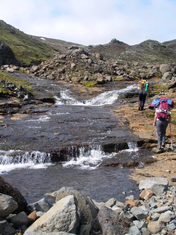 two hikers charcoal trail iceland