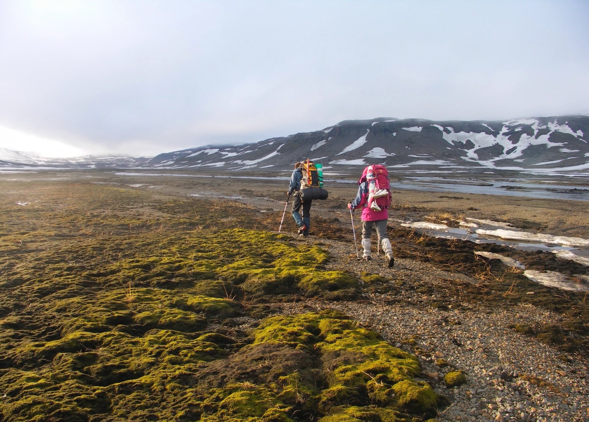 two hikers charcoal trail iceland