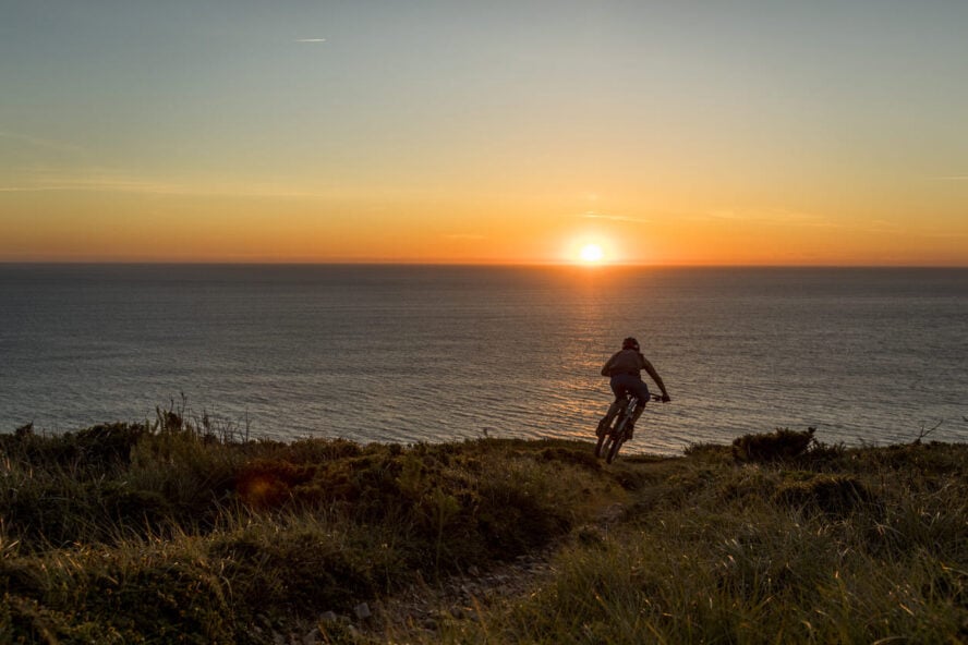 Biking on the Camino with the sunset in the background