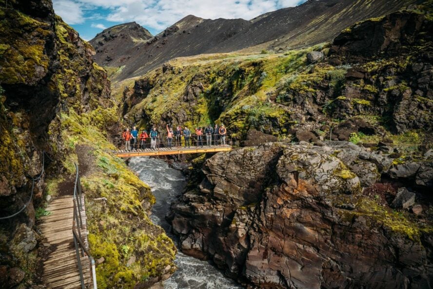 Hikers on a bridge in Iceland
