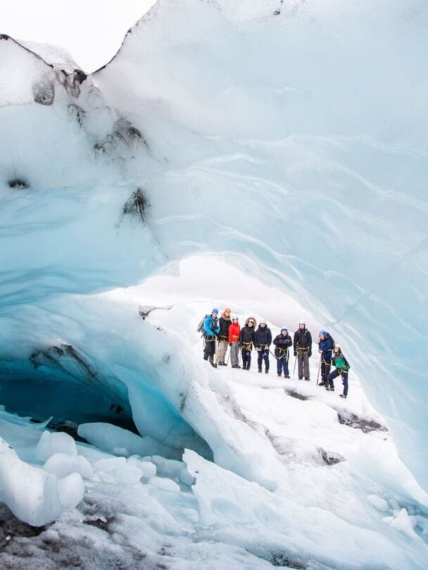 four hikers on a glacier