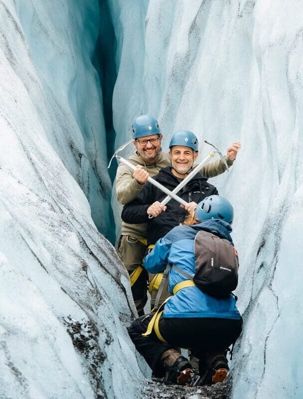 four hikers on a glacier