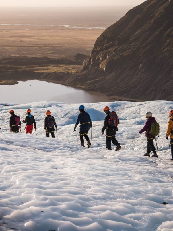 four hikers on a glacier