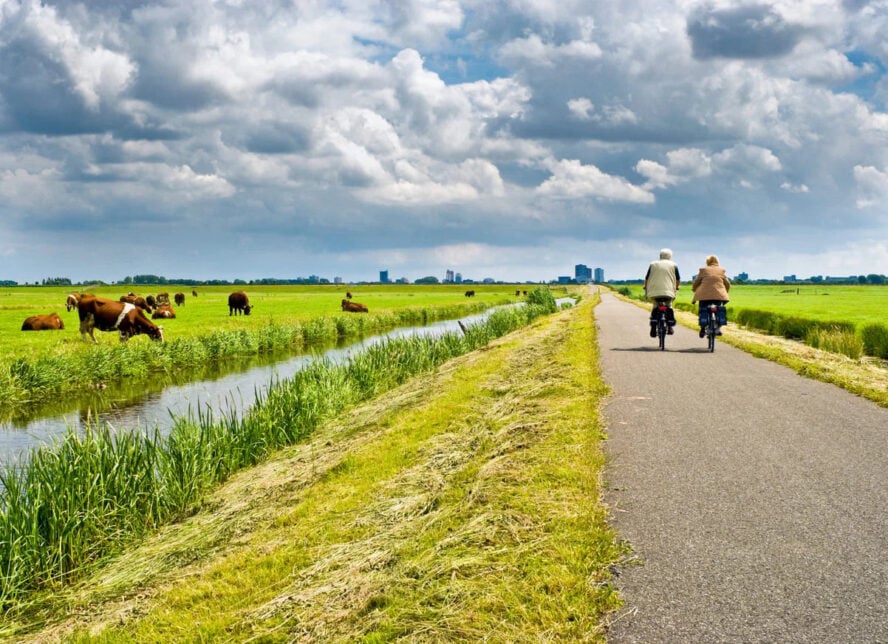 Bike and boat tours in Europe and couple riding in the Netherlands