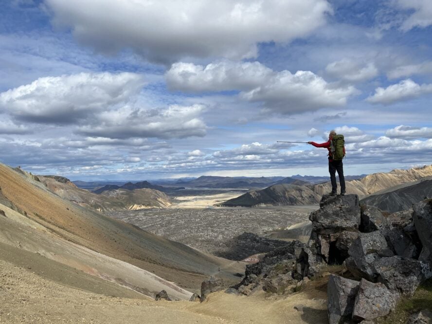 Hiker pointing a pole in Iceland
