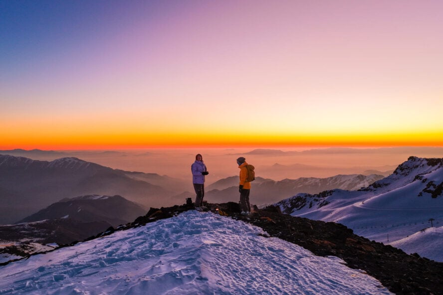 Skiers and a Patagonian sunset
