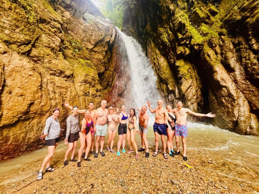 Costa Rica group under a waterfall